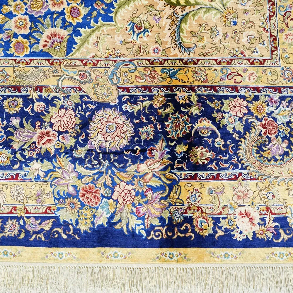 Close up of luxury Persian silk rug with sapphire blue design