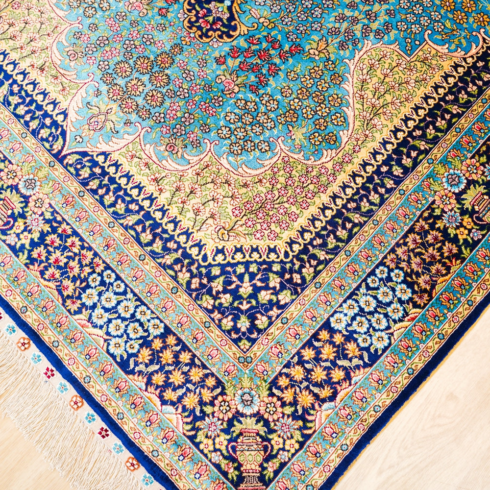 Close-up of a colorful patterned fabric with intricate designs.