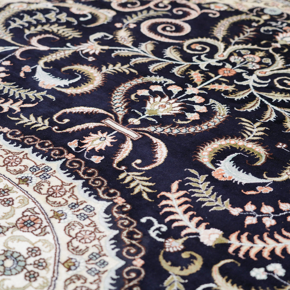 Close up of intricate patterns of Persian silk rug