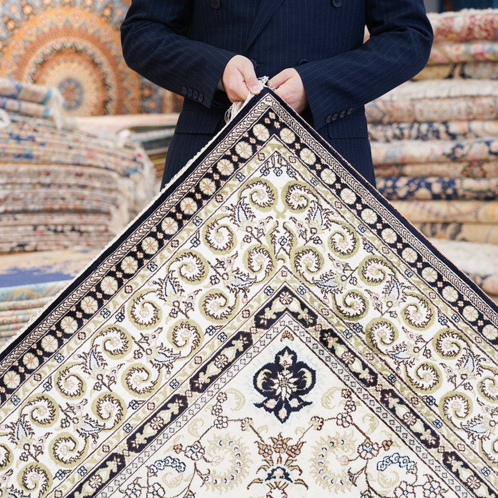 Holding Kashan Obsidian Palace Medallion Rug